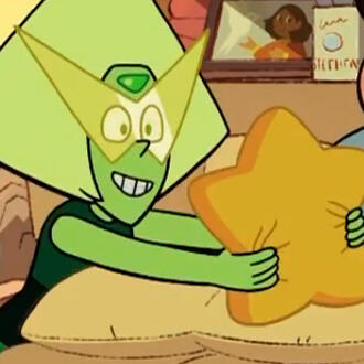 A frame of Peridot from Steven Universe: Future. He is handing someone a star-shaped pillow happily.
